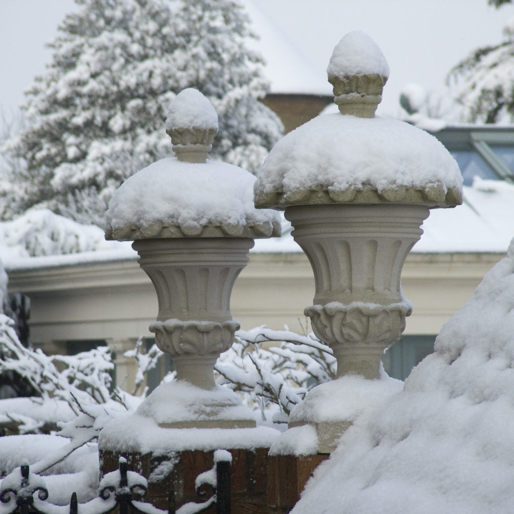 Haddonstone decorative finials photographed in the snow