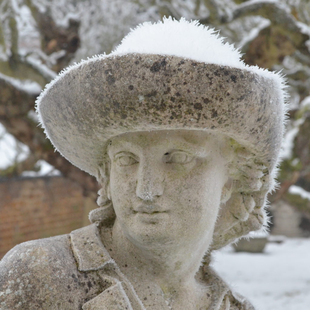 The Haddonstone The Gardener Statue photographed in the snow