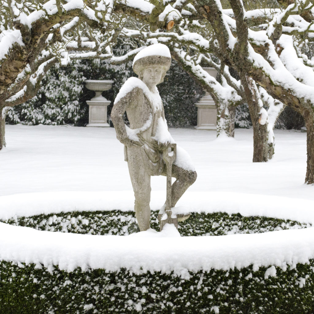The Haddonstone The Gardener Statue photographed in the snow
